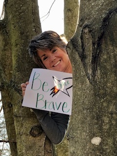 Mrs. Schmitt bravely climbing her favorite tree at home.