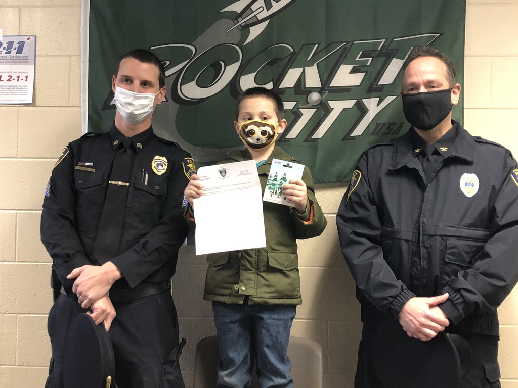 1st grader with Township police officers