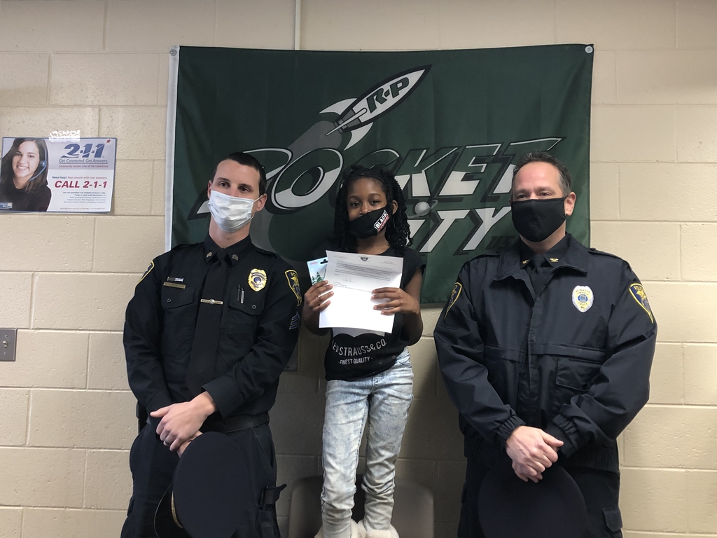 2nd grader with Township police officers