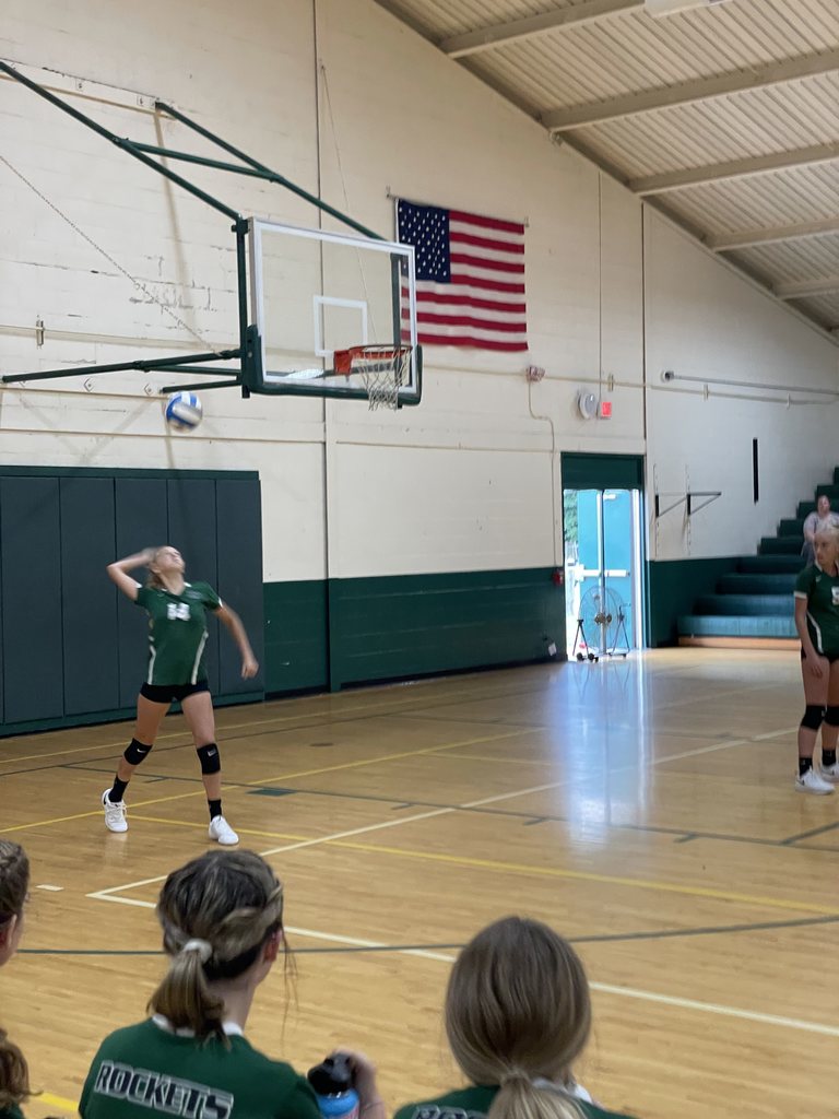 Athlete serving volleyball